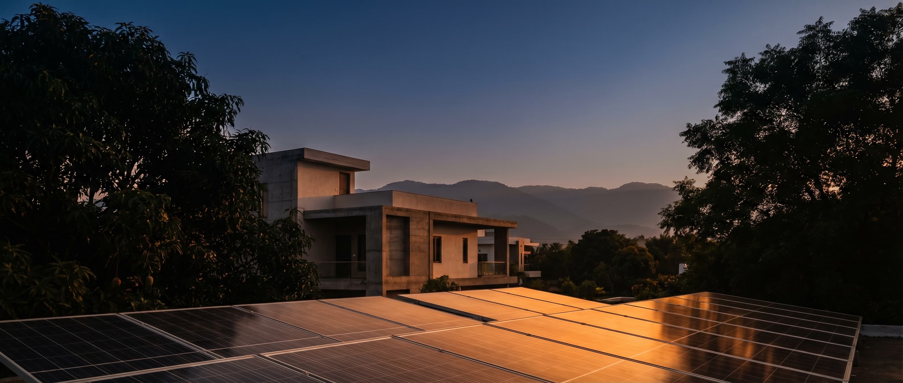 Solar panels on a modern Indian home at golden hour